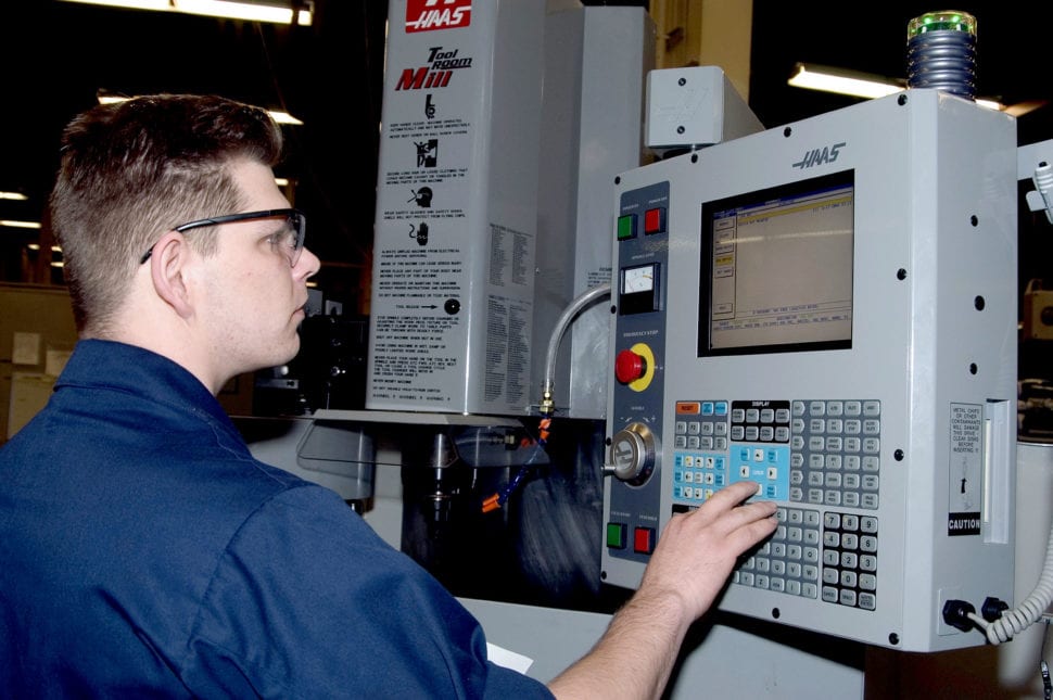 programs the Haas Tool Room Mill to mill brackets for an EA-6B Prowler - doesn't use cam software